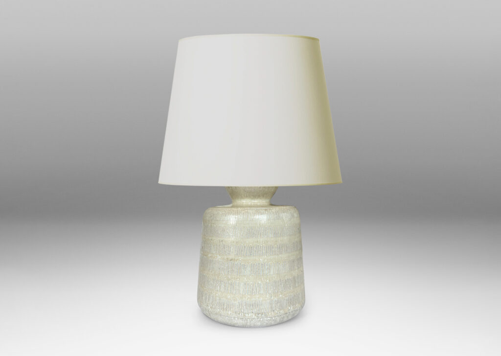 Gallery BAC upwardly tapered cylindrical form with bands of carved strikes; glazed in a dappled oyster / pale gray