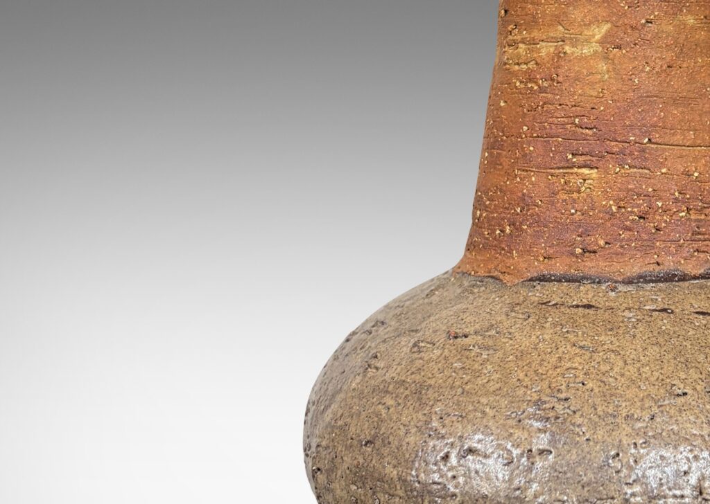 Gallery BAC textured bulbous forms and tall conical necks, glazed in brown and gray-brown