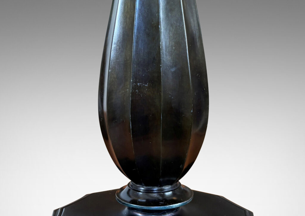 Gallery BAC fluted drop forms on disk plinths with fluted edges, finished in dark bronze tones