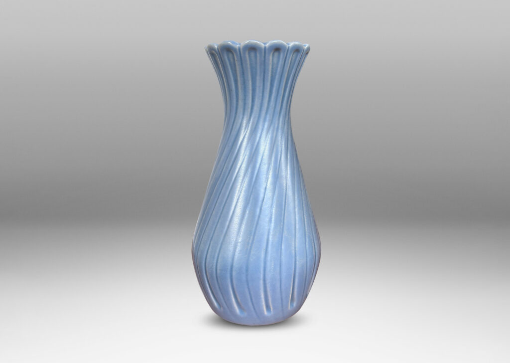 Gallery BAC swelling forms with swirled reeding and scalloped mouths, glazed in an eggshell finish light blue