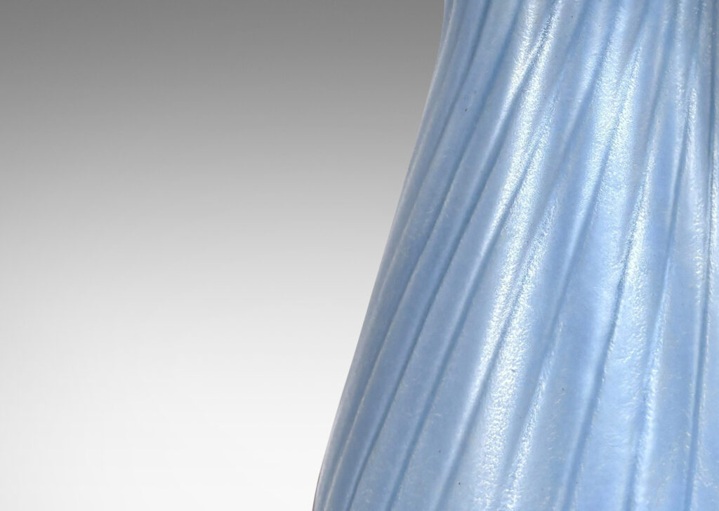 Gallery BAC swelling forms with swirled reeding and scalloped mouths, glazed in an eggshell finish light blue