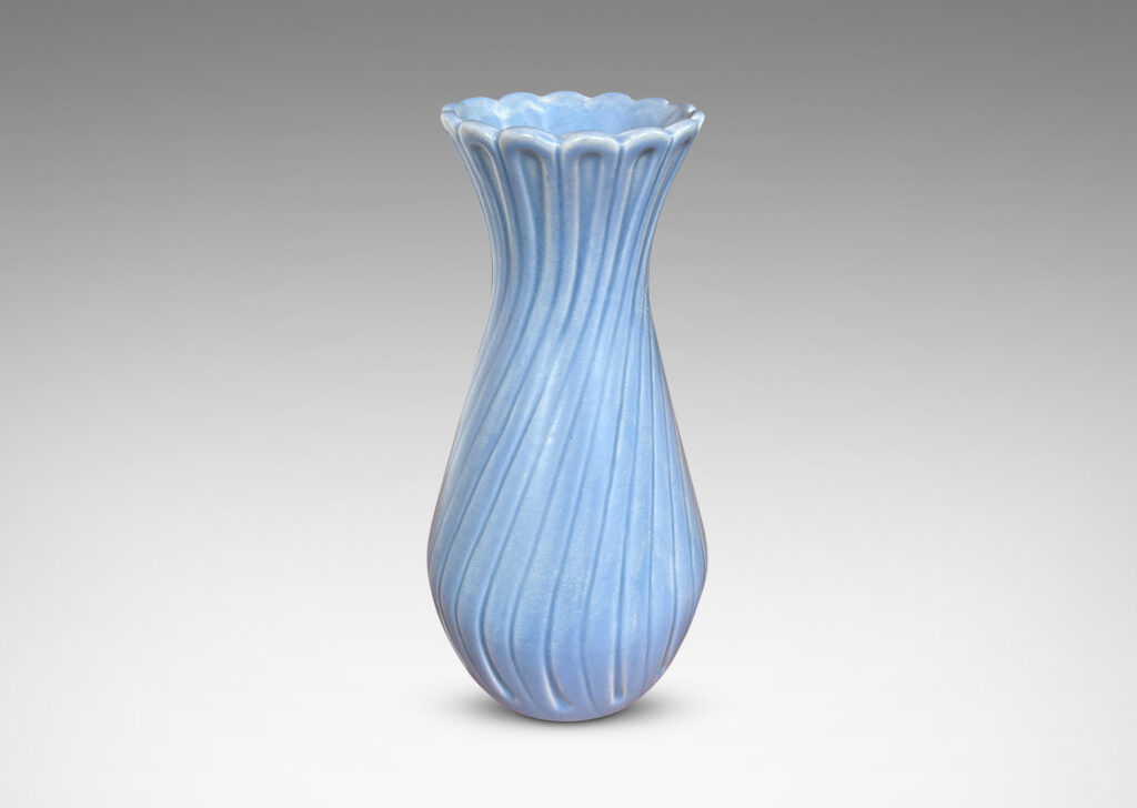 Gallery BAC swelling forms with swirled reeding and scalloped mouths, glazed in an eggshell finish light blue