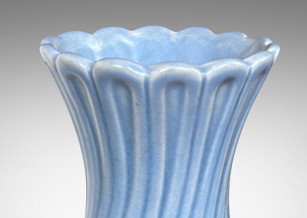 Gallery BAC swelling forms with swirled reeding and scalloped mouths, glazed in an eggshell finish light blue