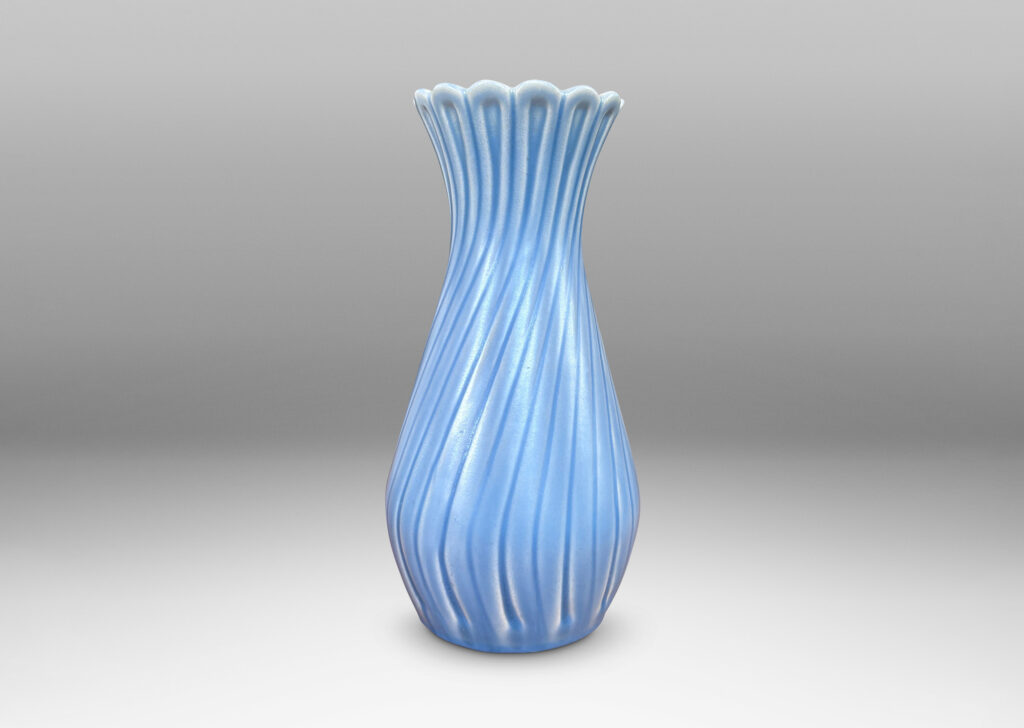 Gallery BAC swelling forms with swirled reeding and scalloped mouths, glazed in an eggshell finish light blue