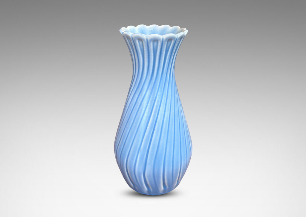 Gallery BAC swelling forms with swirled reeding and scalloped mouths, glazed in an eggshell finish light blue