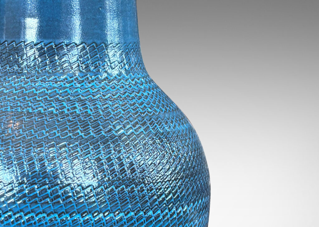 Gallery BAC tapered forms with wide necks and zig-zag texture, glazed in a light gray-blue with gray striae