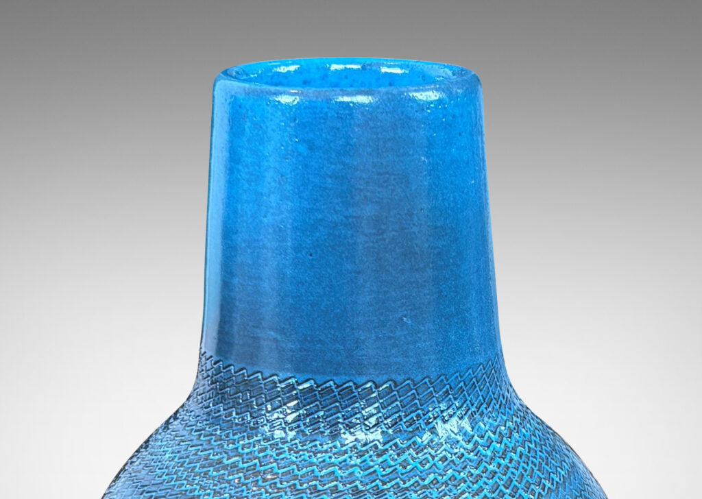 Gallery BAC tapered forms with wide necks and zig-zag texture, glazed in a light gray-blue with gray striae