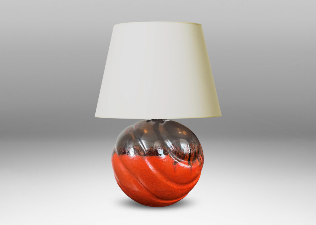 Gallery BAC diagonally lobed globe form, glazed orange overglazed on top with gunmetal gray