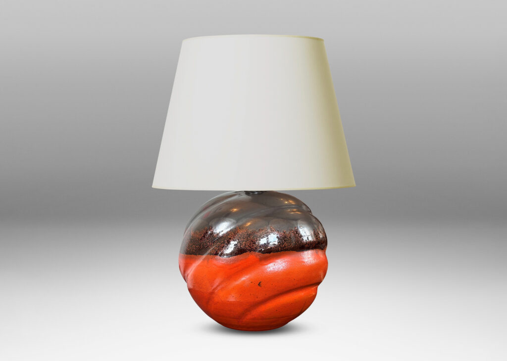 Gallery BAC diagonally lobed globe form, glazed orange overglazed on top with gunmetal gray