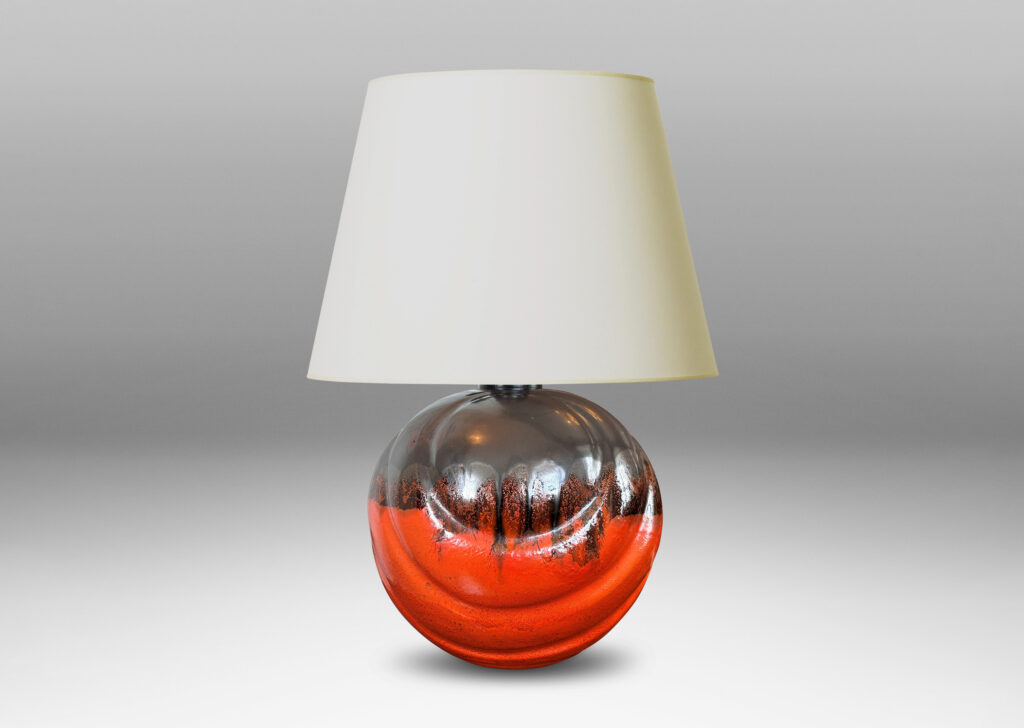 Gallery BAC diagonally lobed globe form, glazed orange overglazed on top with gunmetal gray