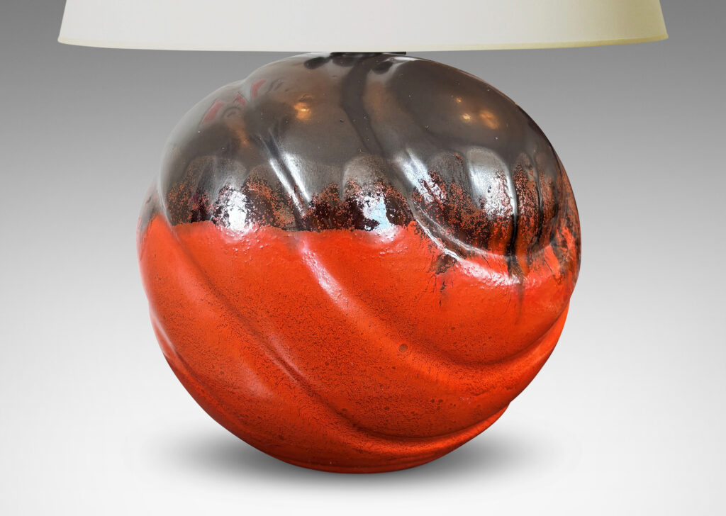 Gallery BAC diagonally lobed globe form, glazed orange overglazed on top with gunmetal gray
