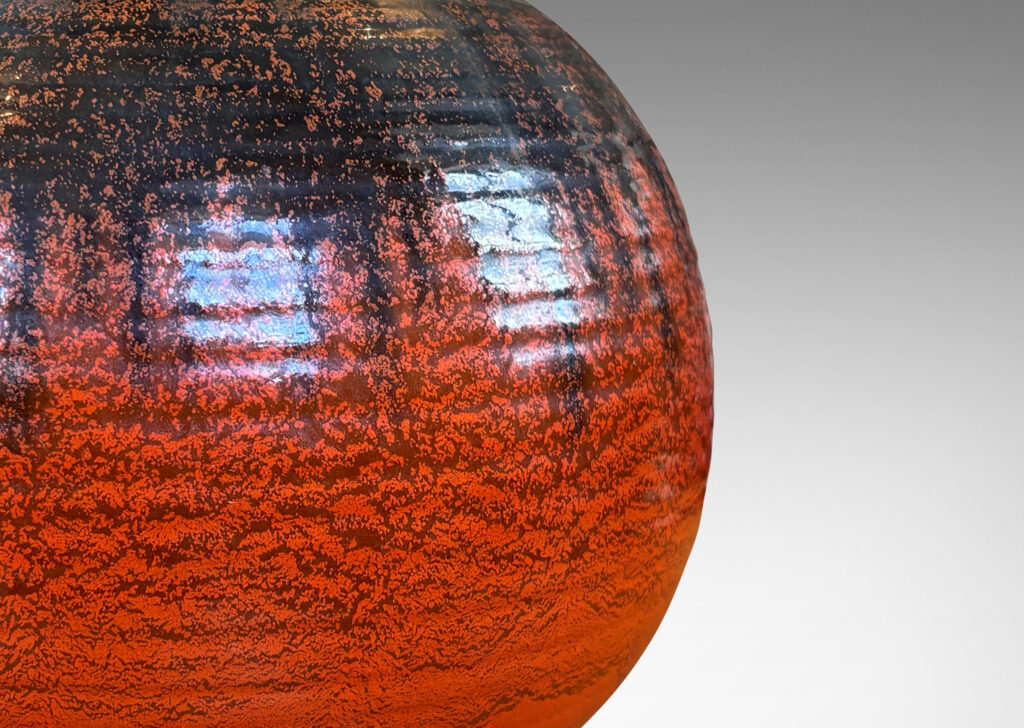 Gallery BAC large ridged plump globe form glazed orange overglazed on top with gunmetal gray