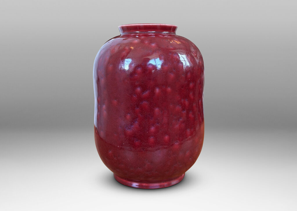 Gallery BAC cinched ovoid form with wide mouth and reveal; glazed in a saturated oxblood burgundy