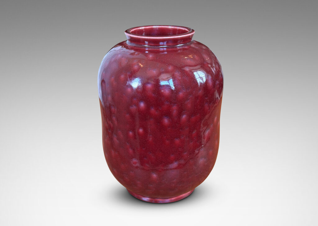 Gallery BAC cinched ovoid form with wide mouth and reveal; glazed in a saturated oxblood burgundy