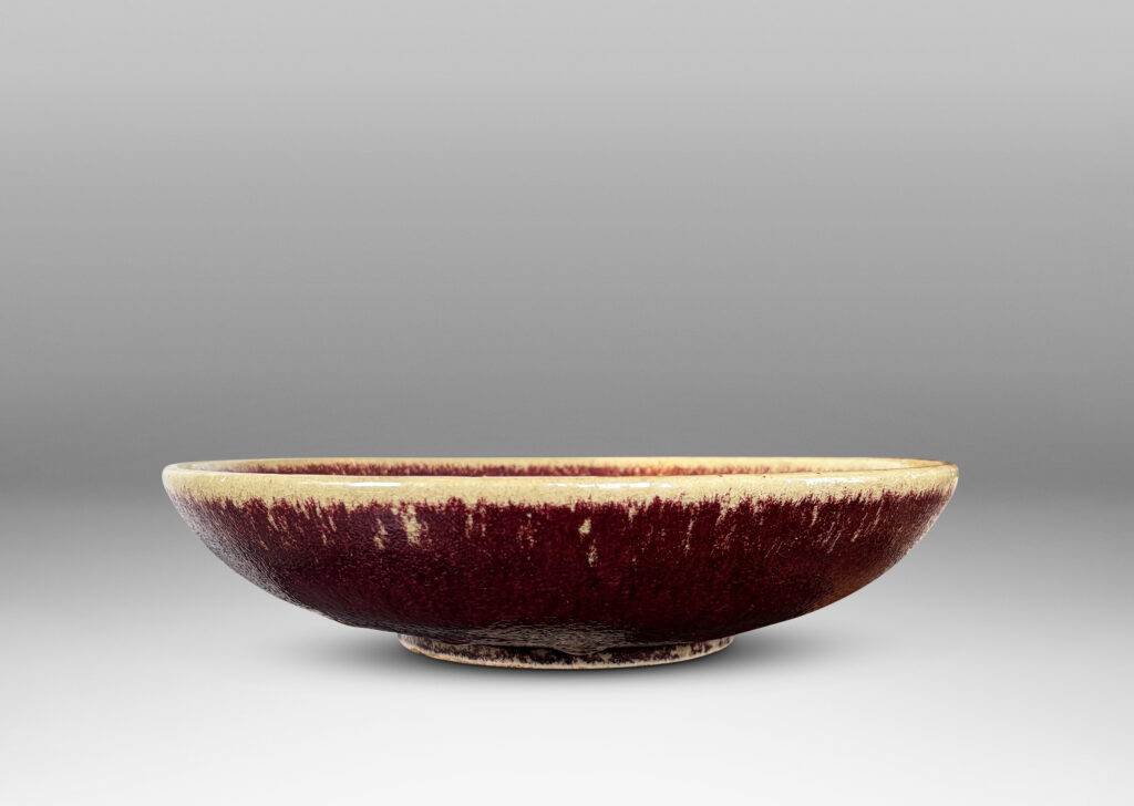 Gallery BAC low wide form glazed in oxblood burgundy with pale gray edge