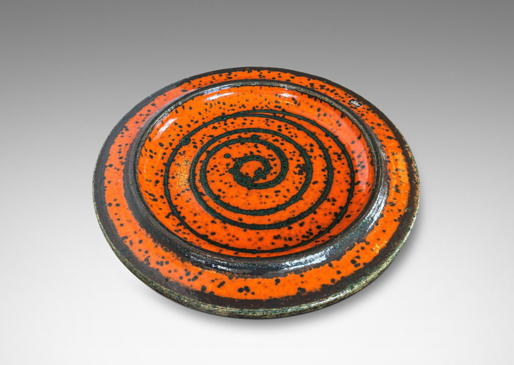 Gallery BAC low profile with wide articulated lip, glazed in black speckled orange, with black spiral design