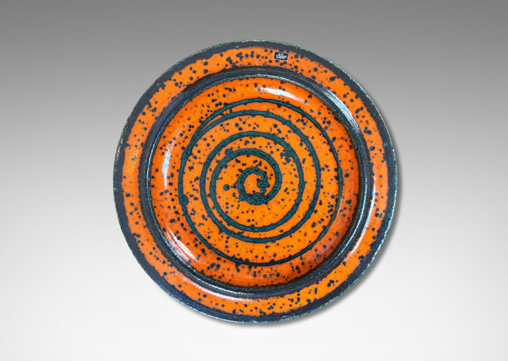 Gallery BAC low profile with wide articulated lip, glazed in black speckled orange, with black spiral design