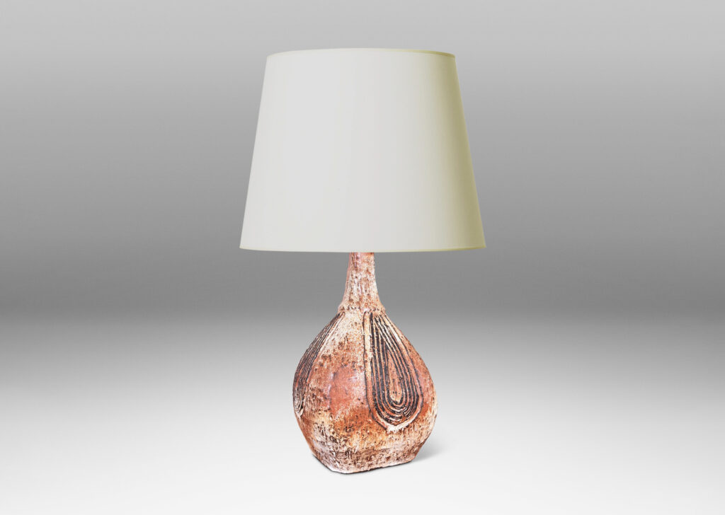Gallery BAC squared bulb form with attenuated neck and carved concentric drop design, glazed in pale gray-tan and brown