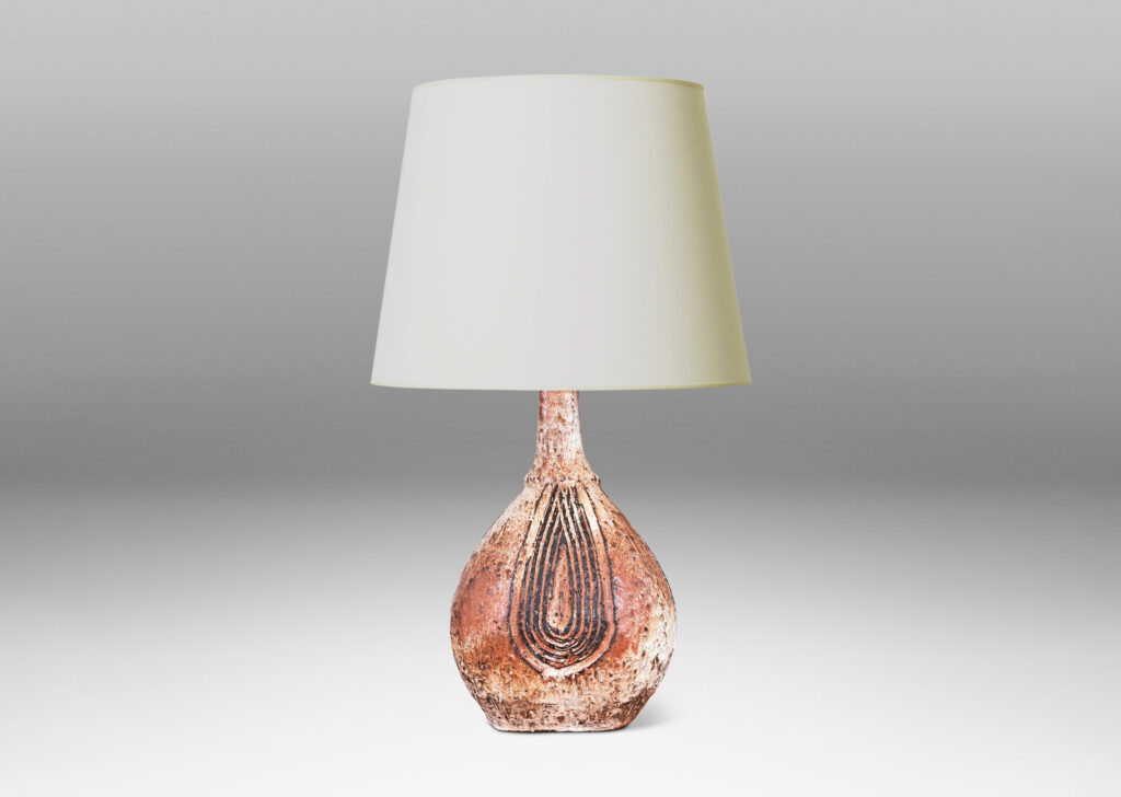 Gallery BAC squared bulb form with attenuated neck and carved concentric drop design, glazed in pale gray-tan and brown