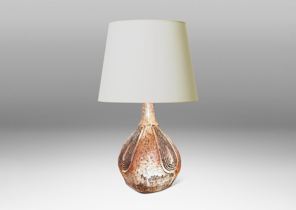 Gallery BAC squared bulb form with attenuated neck and carved concentric drop design, glazed in pale gray-tan and brown