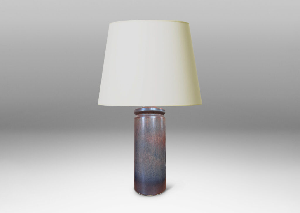 Gallery BAC cylindrical forms with exotic capped tops, glazed in a dark brown harefur