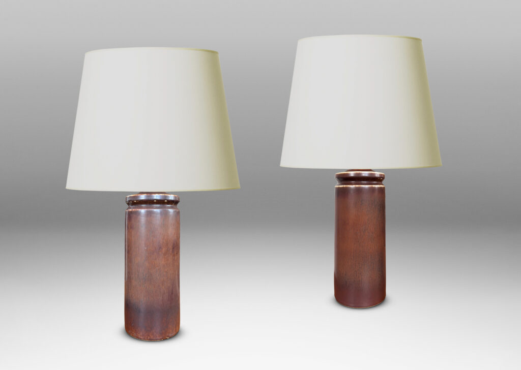Gallery BAC cylindrical forms with exotic capped tops, glazed in a warm medium brown harefur