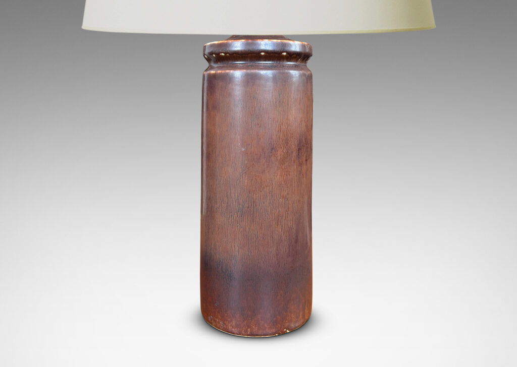 Gallery BAC cylindrical forms with exotic capped tops, glazed in a warm medium brown harefur