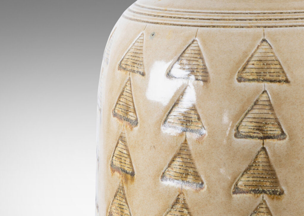 Gallery BAC large upright ovoid form decorated with carved rings and impressed triangle motifs, glazed in a pale topaz-brown