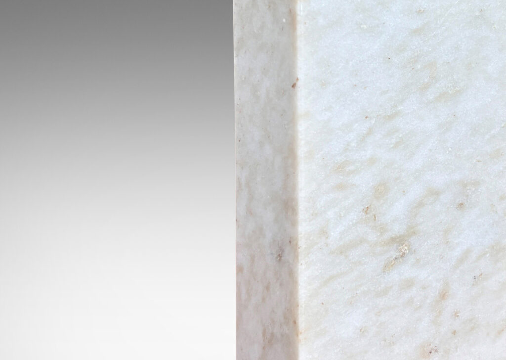 Gallery BAC on-end box forms in pale gray and light brown stone; marble