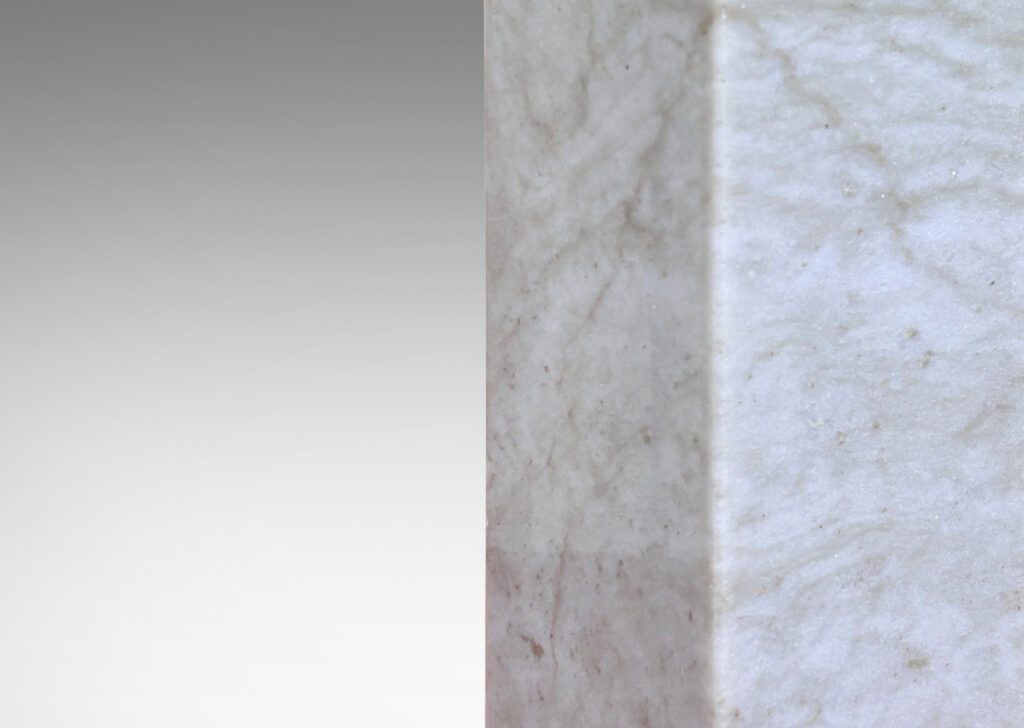 Gallery BAC square pillar forms in pale gray and light brown stone; marble