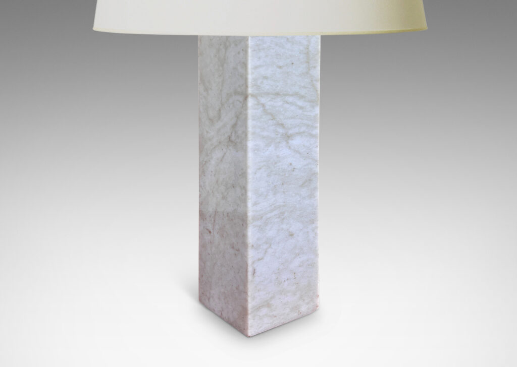 Gallery BAC square pillar forms in pale gray and light brown stone; marble