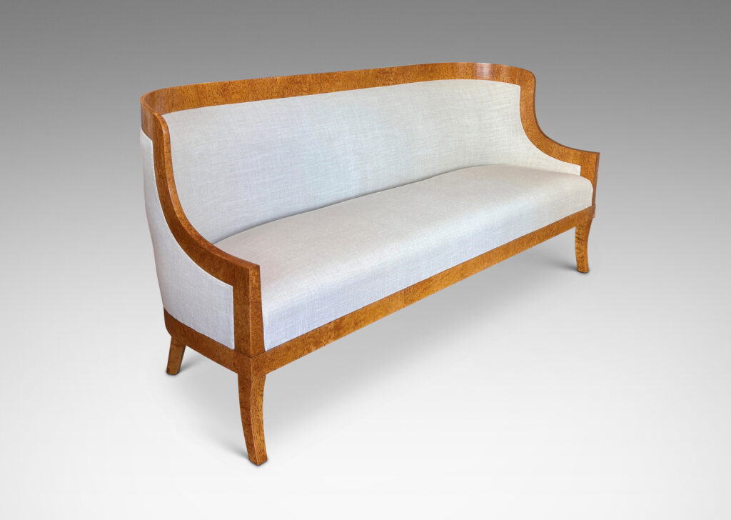 Gallery BAC crafted by the Nordiska Kompaniet workshops for the luxury ocean liner MS Kungsholm, having a curved back, sloped arms and sabered legs, with frames in birch burl