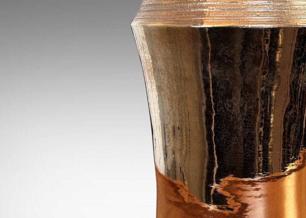 Gallery BAC notched column forms with carved ridging detail; earthenware with a brilliant gold luster glaze