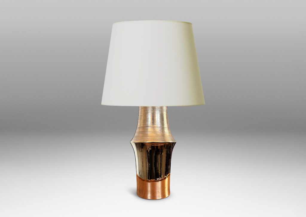 Gallery BAC notched column forms with carved ridging detail; earthenware with a brilliant gold luster glaze