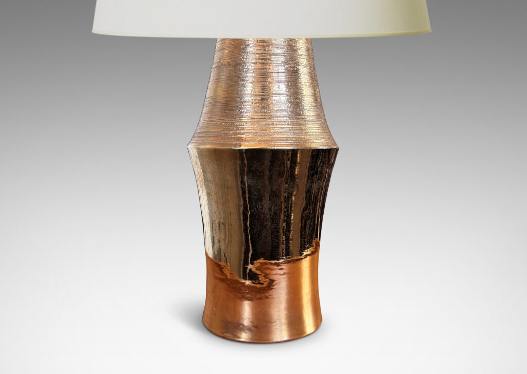 Gallery BAC notched column forms with carved ridging detail; earthenware with a brilliant gold luster glaze