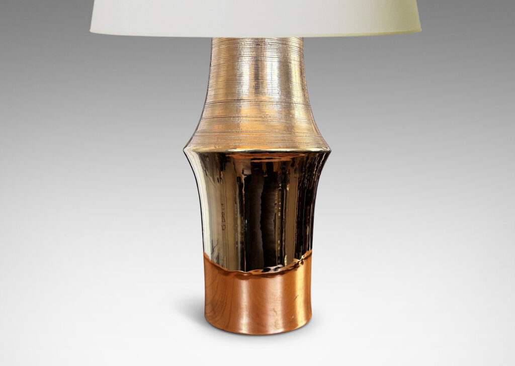 Gallery BAC notched column forms with carved ridging detail; earthenware with a brilliant gold luster glaze