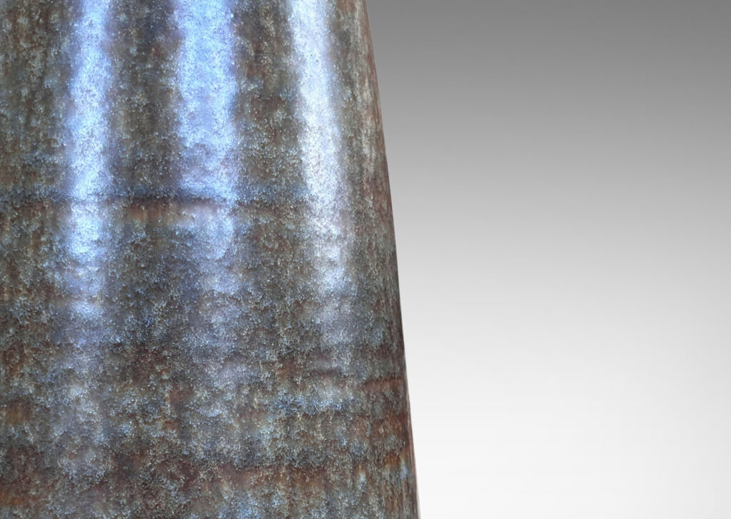 Gallery BAC organically modeled cylindrical form glazed in blue-gray with subtle flowing brown stripes, stoneware