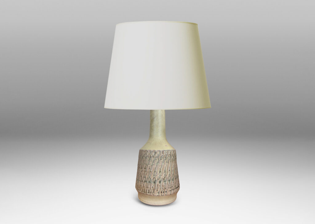 Gallery BAC flared drum forms with rustically textured sides and tall necks, glazed in a matte pale khaki tone; earthenware