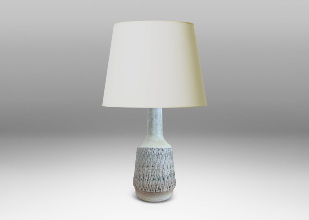 Gallery BAC flared drum forms with rustically textured sides and tall necks, glazed in a matte pale khaki tone; earthenware