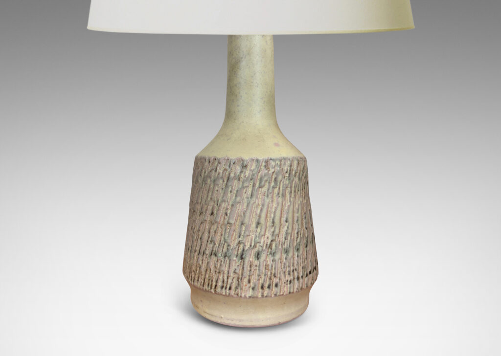 Gallery BAC flared drum forms with rustically textured sides and tall necks, glazed in a matte pale khaki tone; earthenware