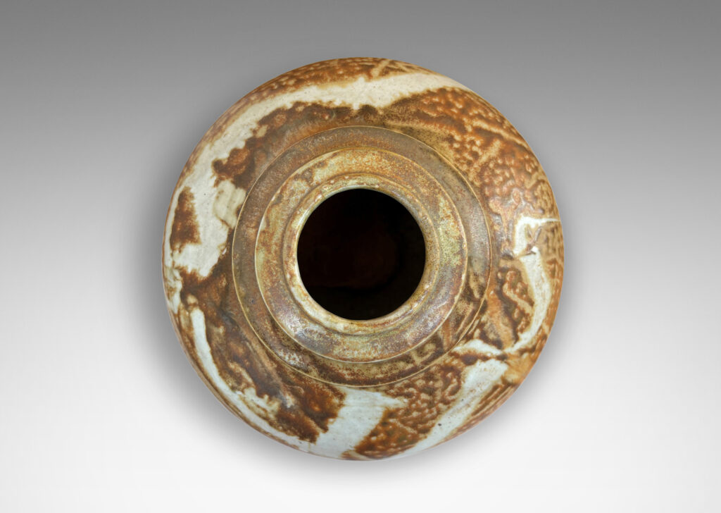 Gallery BAC compressed globe form with notch-articulated mouth, glazed in golden-tan with ivory brushstrokes encircling shoulder