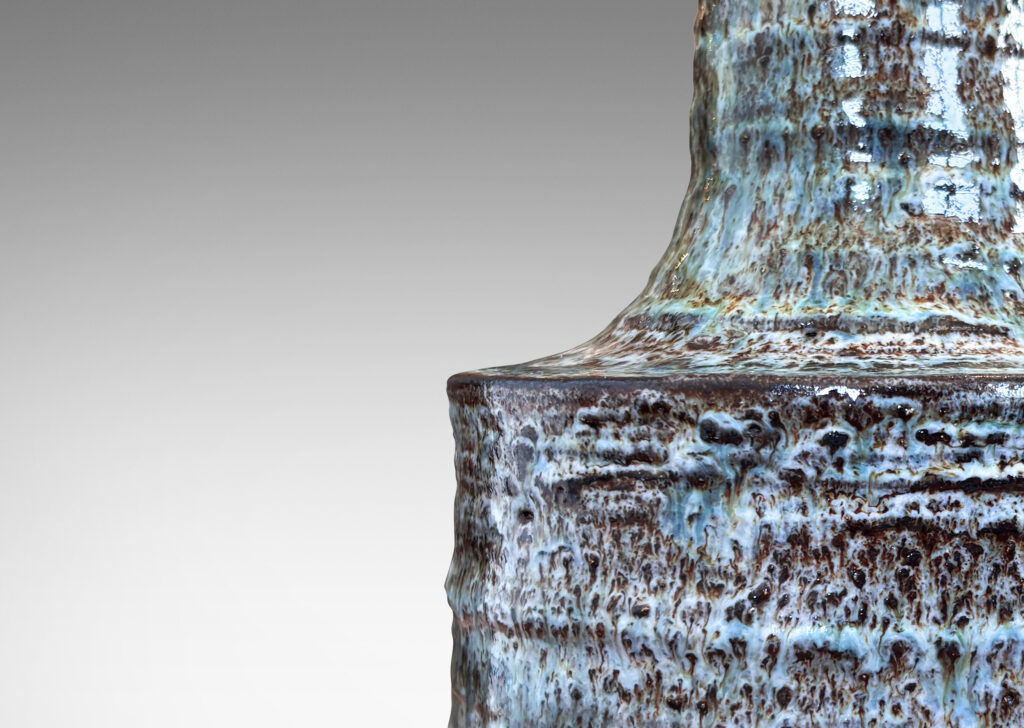 Gallery BAC ridged drum form and sprouting neck, glazed in ice blue-pale gray over brown