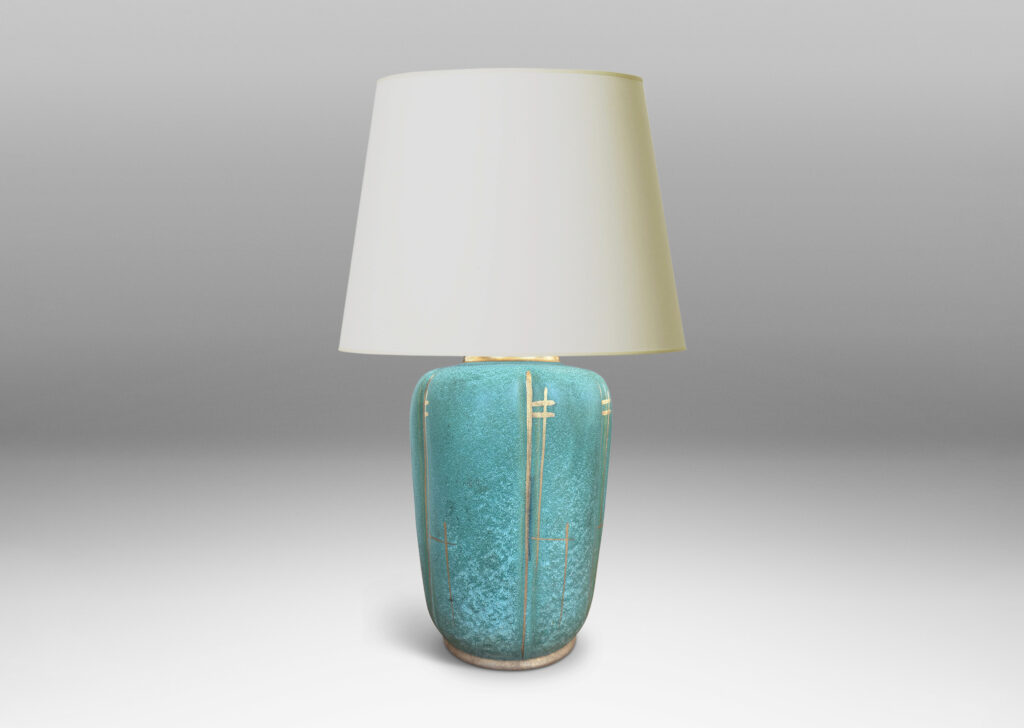 Gallery BAC large lobed ovoid form glazed in a lustrous teal tone with gilded accents