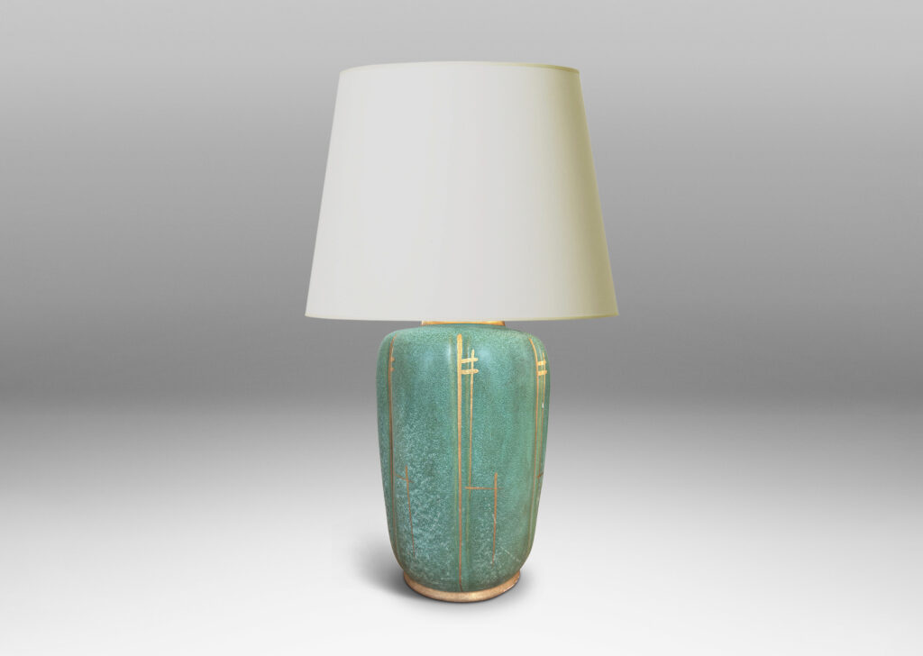 Gallery BAC large lobed ovoid form glazed in a lustrous teal tone with gilded accents