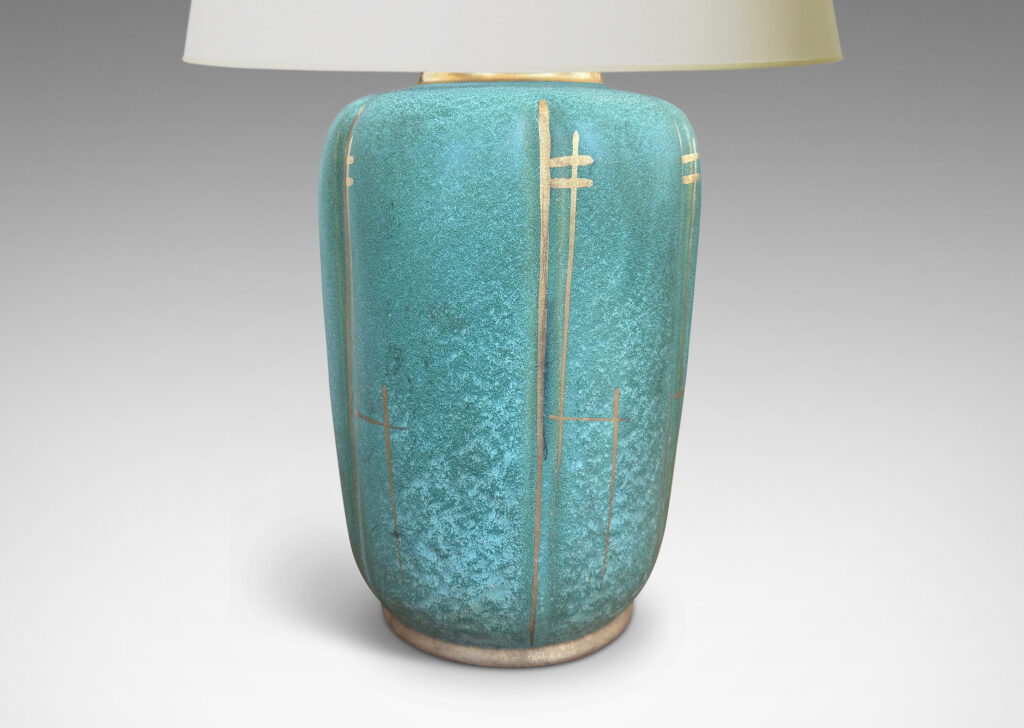 Gallery BAC large lobed ovoid form glazed in a lustrous teal tone with gilded accents
