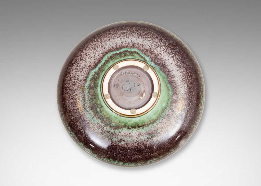 Gallery BAC beautifully sculpted wide shallow form with lip finished in carved hatch marks and a marvelous oxblood-celadon glaze