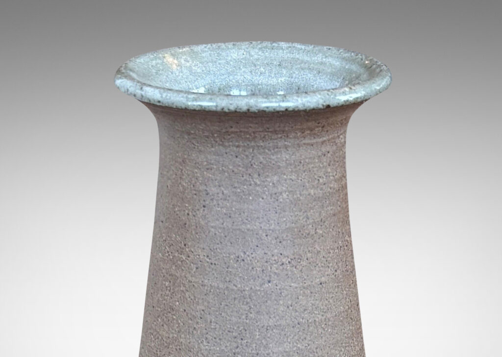 Gallery BAC cylindrical body, conical neck, and outstretched mouth, glazed in gray and matte brown