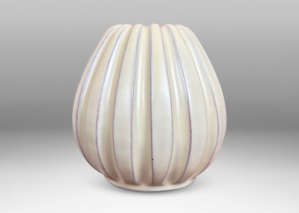 Gallery BAC vertically fluted bulbous form in a pale yellow-ivory glaze