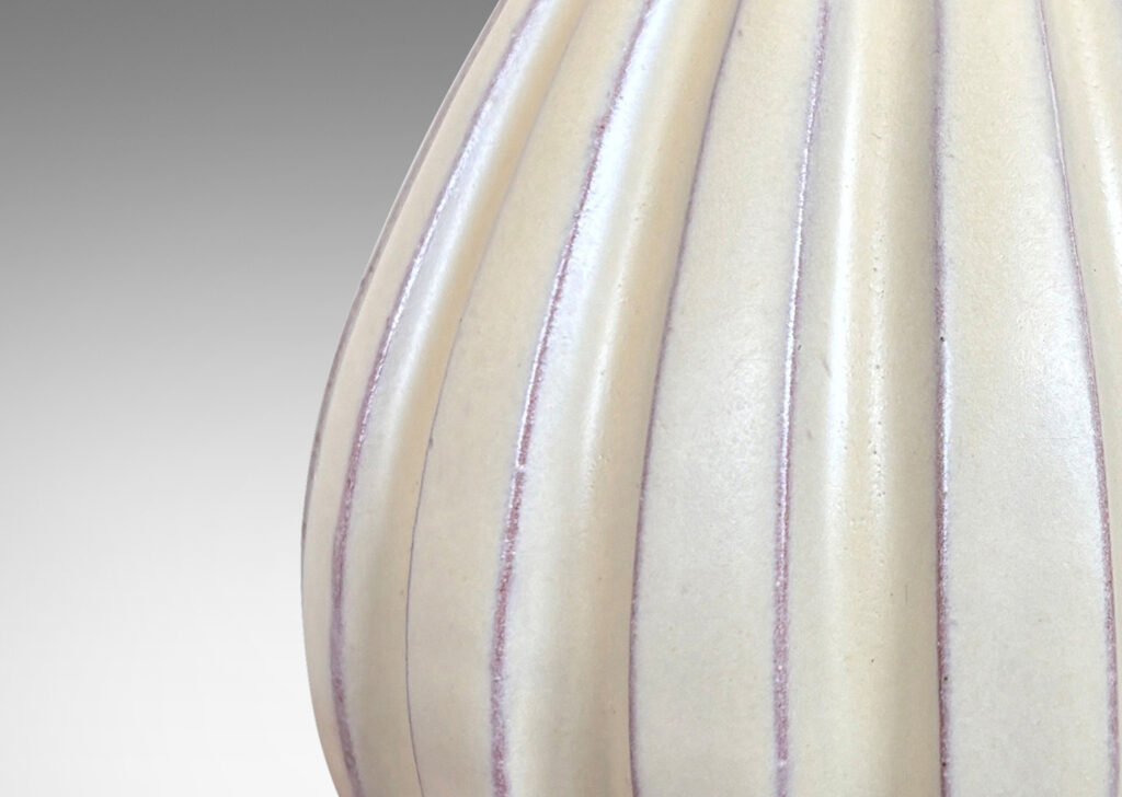 Gallery BAC vertically fluted bulbous form in a pale yellow-ivory glaze