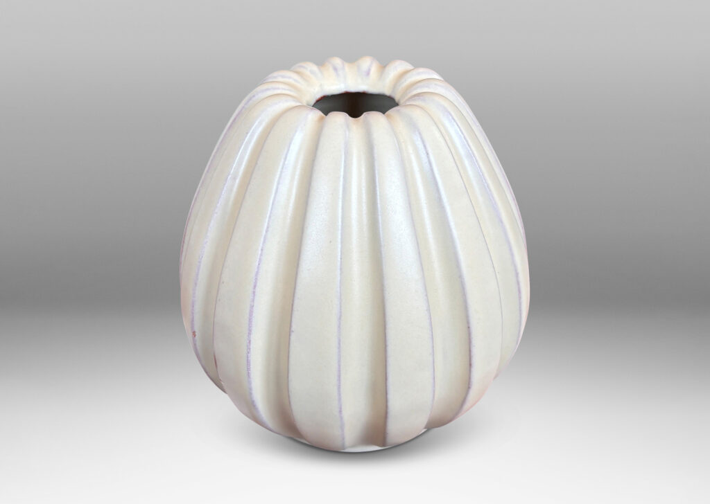 Gallery BAC vertically fluted bulbous form in a pale yellow-ivory glaze